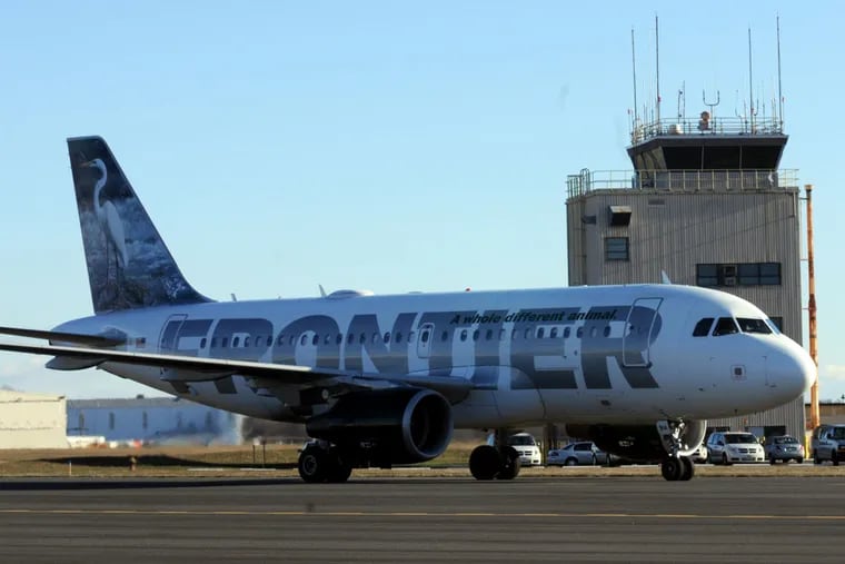 A Frontier Airlines jet taxis at Trenton-Mercer County Airport.