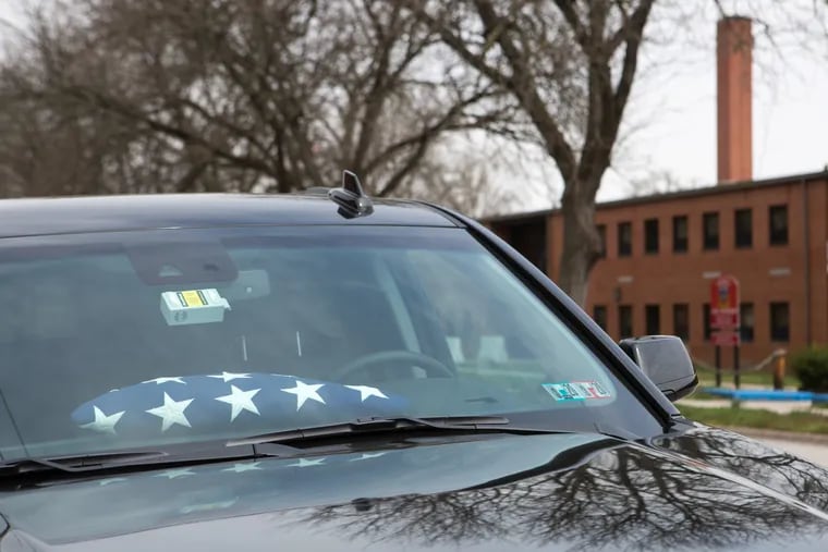 Pictured is a flag in a vehicle outside the reserve unit in Harrisburg, Pa., Friday April 12, 2019. One of the soldiers will be presented this flag to the family of the fallen soldier killed this week in Afghanistan. For the Inquirer/Kalim A. Bhatti