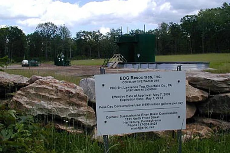 An EOG well at the Punxsutawney Hunting Club. The large containers collect liquids from the well's wastewater and fuel. (ANDY MAYKUTH / Staff)