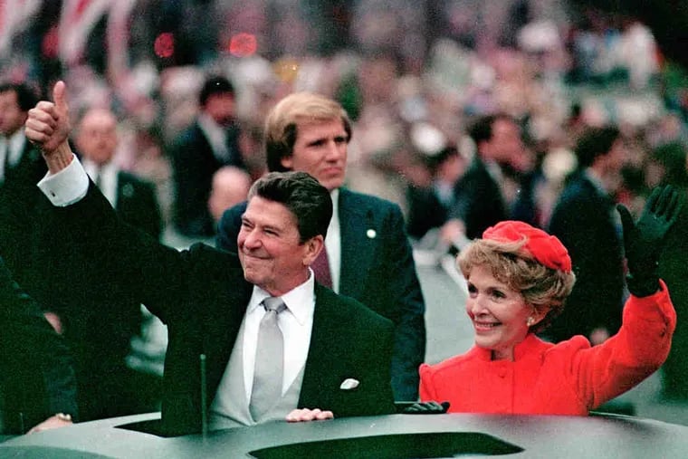 President Ronald Reagan, with wife Nancy, gave a thumbs-up to the crowd during his inaugural parade on Jan. 20, 1981.