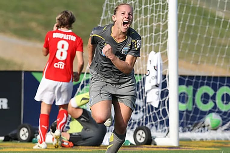 Amy Rodriguez celebrates after scoring the winning goal in the final minute of extra time. (Robyn McNeil/ISI Photos)