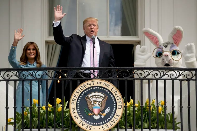 President Donald Trump, joined by the Easter Bunny and first lady Melania Trump speaks from the Truman Balcony of the White House in Washington, Monday, April 22, 2019, during the annual White House Easter Egg Roll. (AP Photo/Andrew Harnik)