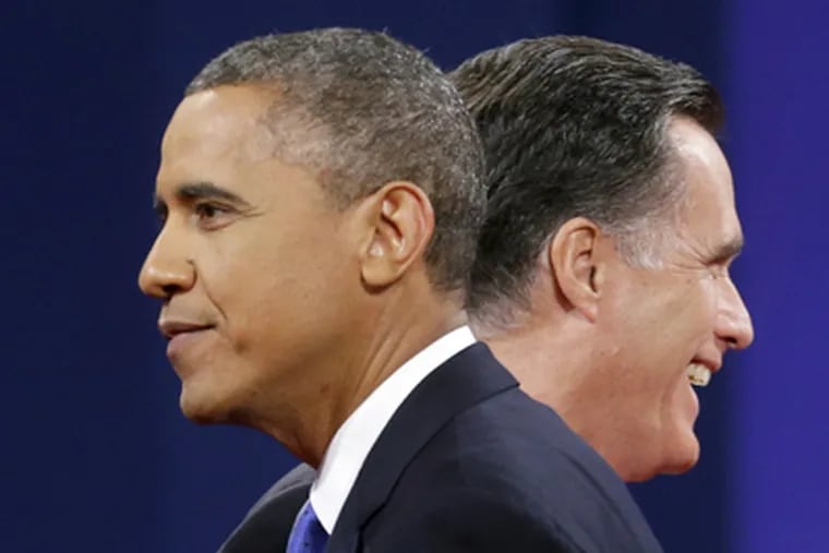 Republican presidential candidate, former Massachusetts Gov. Mitt Romney and President Barack Obama walk past each other on stage at the end of the last debate at Lynn University, Monday, Oct. 22, 2012, in Boca Raton, Fla. (AP Photo / Pablo Martinez Monsivais)