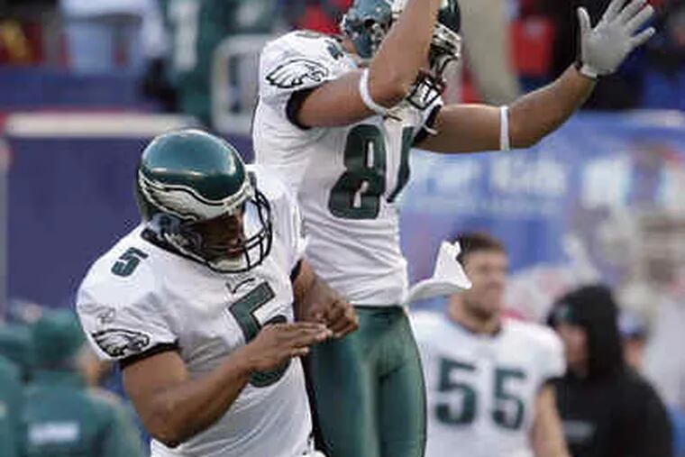 Donovan McNabb (left) and L.J. Smith celebrate touchdown pass in fourth quarter.