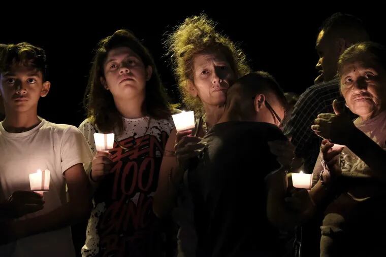 A candlelight vigil for the victims of a fatal shooting was held at the First Baptist Church in Sutherland Springs, Texas, on Sunday night. From left: Christopher Rodriguez, Esmeralda Rodriguez, Mona Rodriguez, Jayanthony Hernandez, 12, and Juanita Rodriguez.