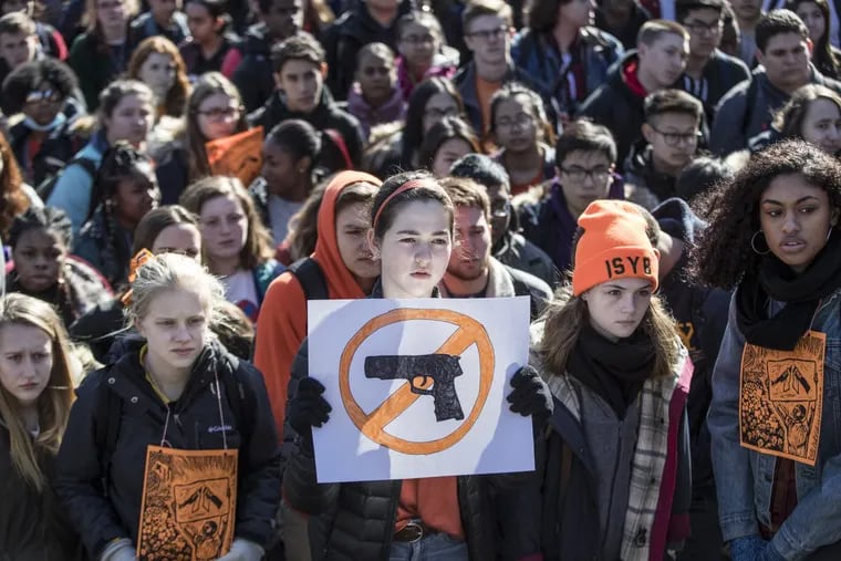 Maayan Kaplan (center), 16, was one of over 1,000 Central High students who walked out of class to protest gun violence Wednesday.