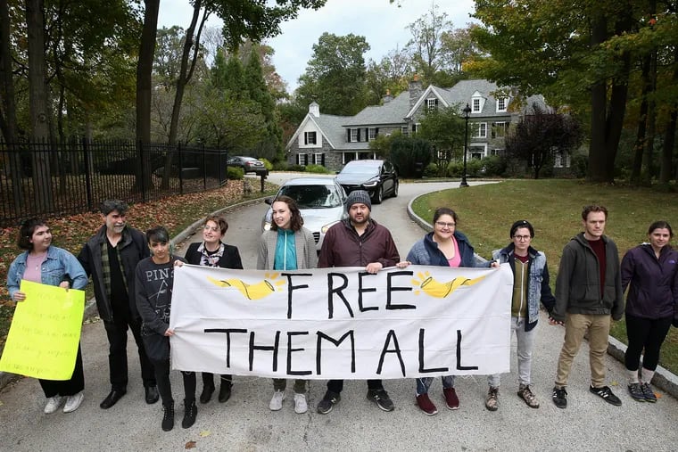 Protesters block the street leading to a Devereux Advanced Behavioral Health facility in Villanova as a show of opposition to Devereux's plans to build a facility in Devon to hold unaccompanied minors who illegally crossed the border.