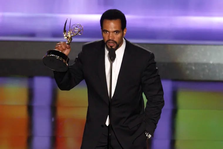 FILE - In this June 20, 2008, file photo Kristoff St. John accepts the award for outstanding supporting actor in a drama series for his work on "The Young and the Restless" at the 35th Annual Daytime Emmy Awards in Los Angeles. Officials say St. John died of heart disease, with heavy drinking at the time of his death as a contributing factor. A coroner’s report released Tuesday lists “hypertrophic heart disease” as the cause of the 52-year-old’s death on Feb. 4 at his home in Los Angeles.