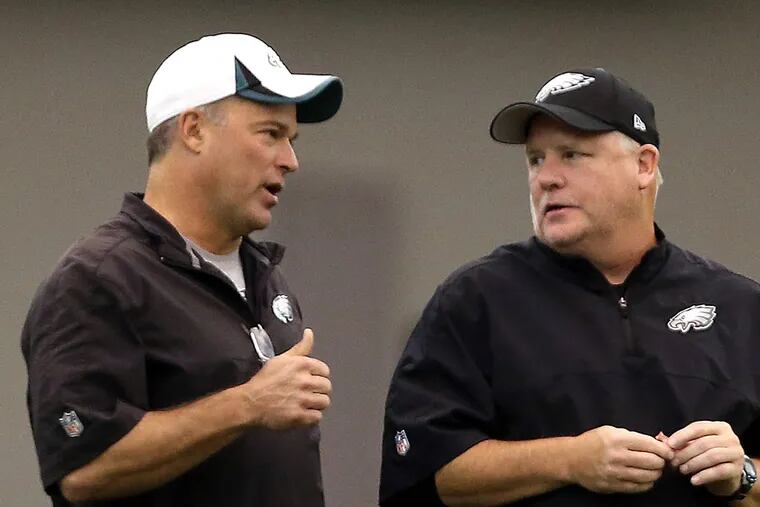 Bill Davis (left) with Eagles coach Chip Kelly. (David Maialetti/Staff Photographer)