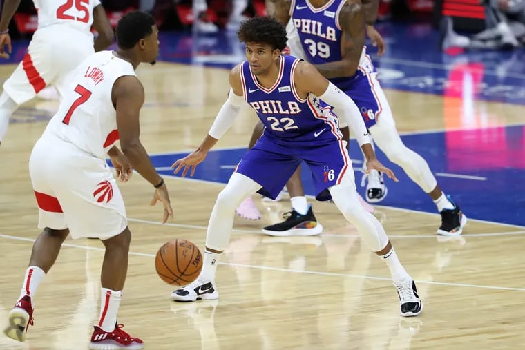 Kyle Lowry, left, dribbling in front of the Sixers' Matisse Thybulle during the Raptors-Sixers game at the Wells Fargo Center on Dec. 29.