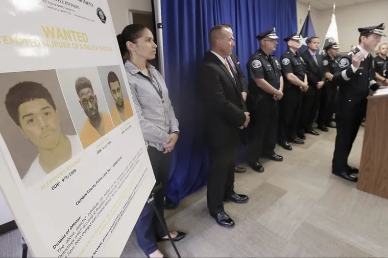 Law enforcement officials and Camden County Police Chief Scott Thomson (right) release photos of the 3 men wanted in connection with the attempted murder of two Camden County undercover detectives on Aug. 7,2018.  ELIZABETH ROBERTSON / Staff Photographer