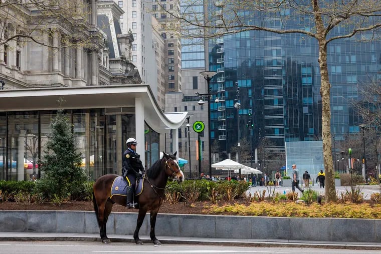 An officer with Philadelphia Mounted Police Unit at the northwest corner of City Hall.