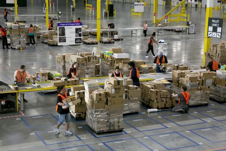 Amazon workers in the sortation center in Kent, Wash., in 2014.