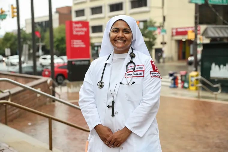 Sister Jocelyn Edathil, a doctor of internal medicine and a nun, stands stands outside her workplace, Temple University Hospital. Edathil belongs to the Sisters of the Imitation of Christ.