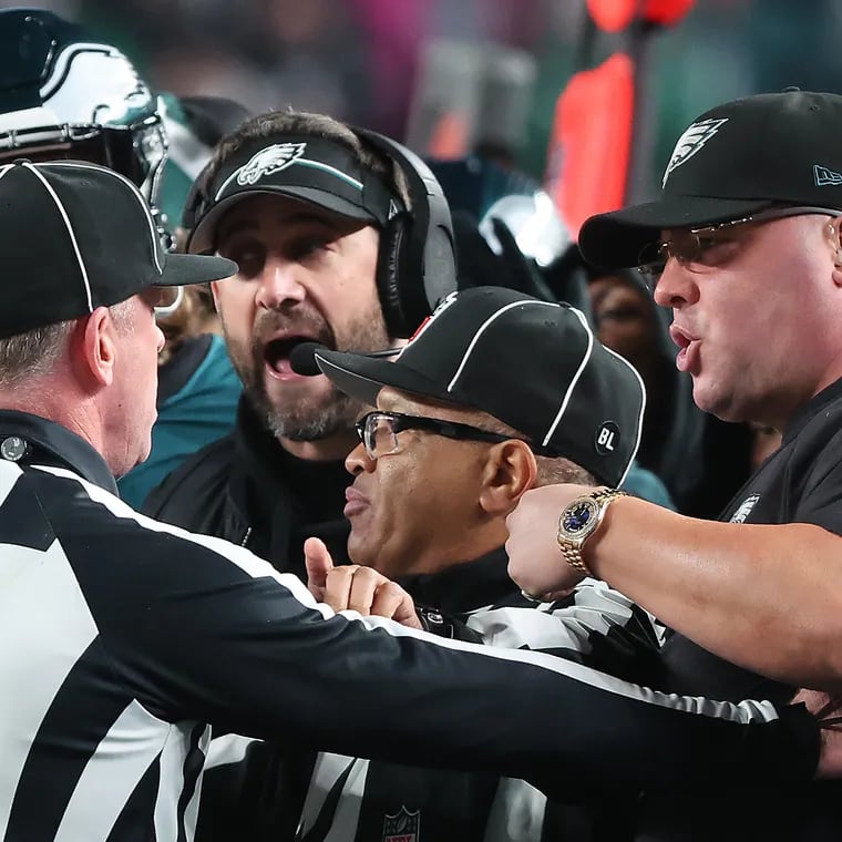 Eagles coach Nick Sirianni and chief security officer Dom DiSandro (right) talk with officials after DiSandro and the 49ers' Dre Greenlaw were involved in a sideline incident during a game in December.