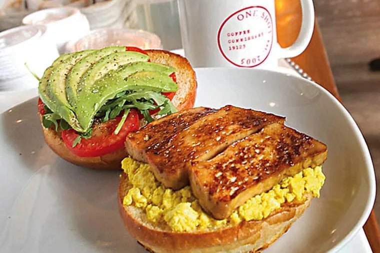 One Shot Cafe's A.B.E Breakfast Sandwich, vegan version with house made tofu scramble, cured fakin bacon, avocado, tomatoes and arugula. One Shot Cafe is in Northern Liberties. ( ALEJANDRO A. ALVAREZ / STAFF PHOTOGRAPHER )