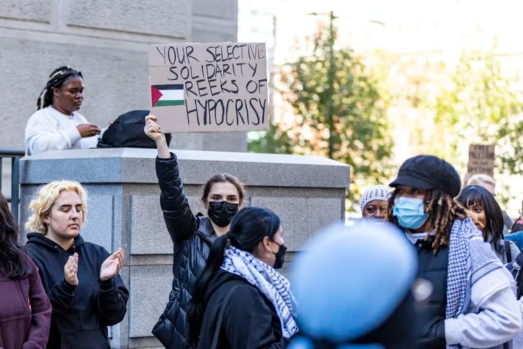 Demonstrators gathered outside City Hall and packed City Council chambers to oppose a resolution condemning Hamas and calling for peace in the Israel-Palestine conflict.