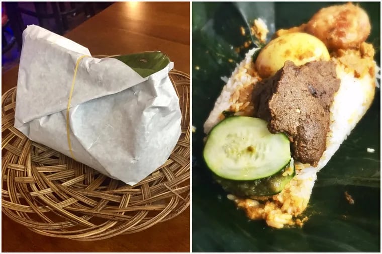 Nasi bungkus, a banana leaf package wrapped round beef rendang, rice and jackfruit, from Sky Cafe. Craig LaBan/Staff