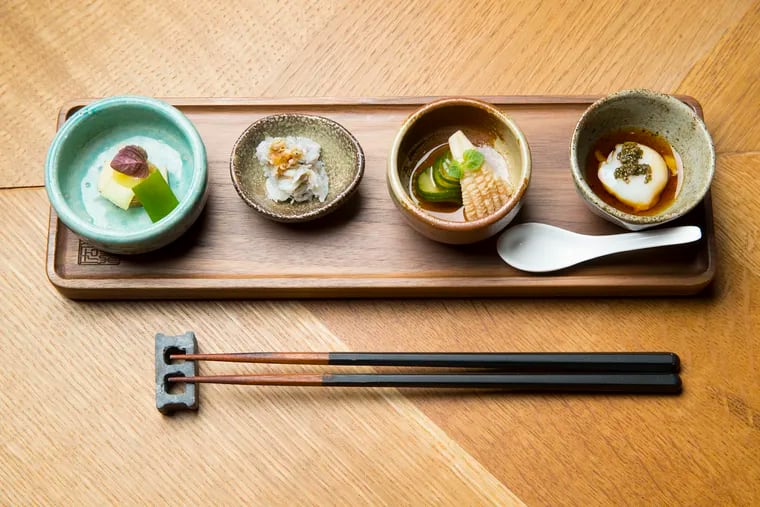 The Zensai. L-R: Squid with sunomono (cucumber salad), Shirasu (baby sardine) with grated radish, yuzu soy, bamboo shoot with scallion and sumiso, Onsen Tamago (poached quail egg) with dashi, soy, mirin and tonburi (mountain caviar).  This is part of the omakase fixed-price Japanese meal at Hiroki on Aug. 1, 2019. The meal includes a multi-course meal of sushi and cooked food.