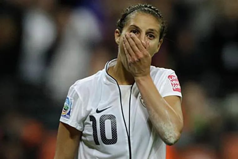 U.S. midfielder Carli Lloyd reacts after missing during the penalty shoot-out of the Women’s World Cup. (Frank Augstein/AP)