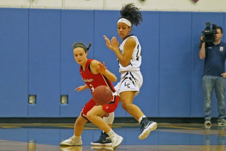 Jenkintown's Mia Kolb left and Lebanon Catholic's Jasmine Turner chase a loose ball during the first half of a girls Class A state semifinal basketball game, Saturday March 24, 2018, in Downingtown, PA.( H. Rumph Jr / For the Inquirer )