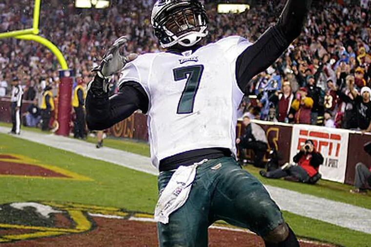 Michael Vick racked up 333 passing yards and 80 rushing yards as the Eagles blew out the Redskins. (Yong Kim/Staff Photographer)