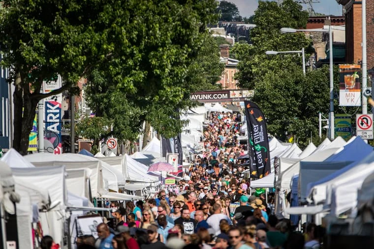 The two-day Manayunk Arts Festival draws 300 vendors and hundreds of thousands of visitors to the neighborhood's Main Street.