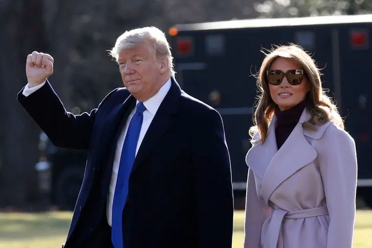 U.S. President Donald Trump gestures as he walks with first lady Melania Trump on the South Lawn of the White House before their departure to Palm Beach, Fla., on Jan. 17, 2020 in Washington, D.C.