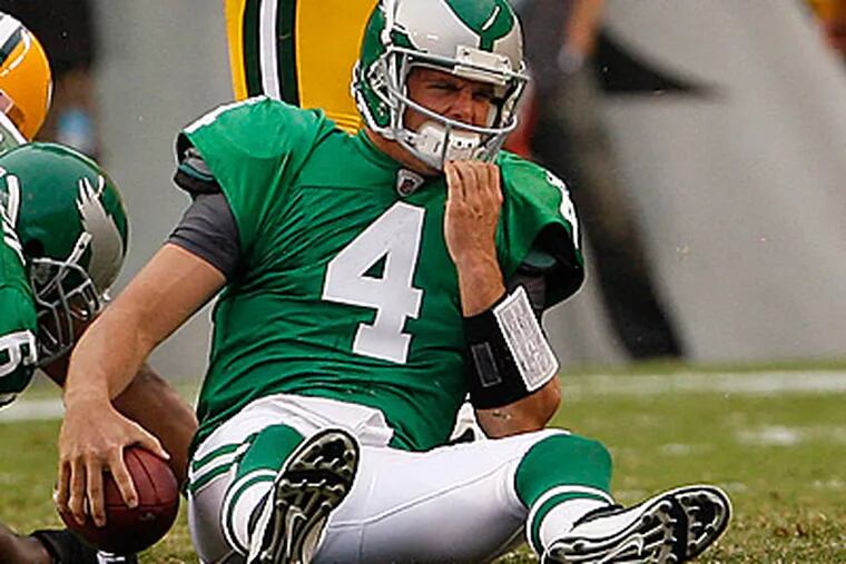 Kevin Kolb reacts after being sacked in first half. (Ron Cortes/Staff Photograher)