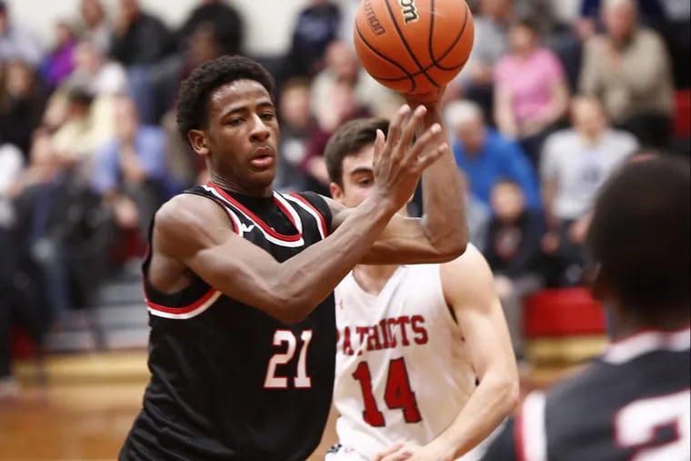 Archbishop Ryan’s Izaiah Brockington passes to a teammate against Germantown Academy in a game in December 2016.