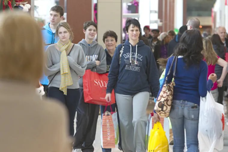 Looking for bargains at Cherry Hill Mall were Tracy Risse (center) of Haddonfield, with her children (from left) Matt, Taylor, and Ryan, and her mother, Margaret Theckston. (Ed Hille / Staff Photographer)