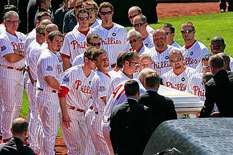 Phillies players line up to pay their respects during a ceremony at Citizens Bank Park on Saturday. (Akira Suwa / Staff Photographer )