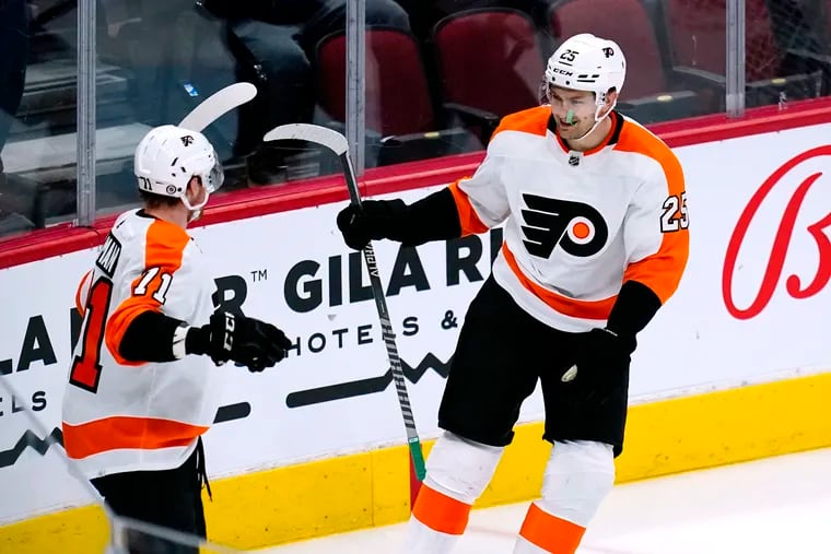 Flyers left winger James van Riemsdyk (25) celebrates his goal against the Arizona Coyotes with Max Willman (71) during the first period Saturday. Van Riemsdyk scored twice in the Flyers' 5-3 win.
