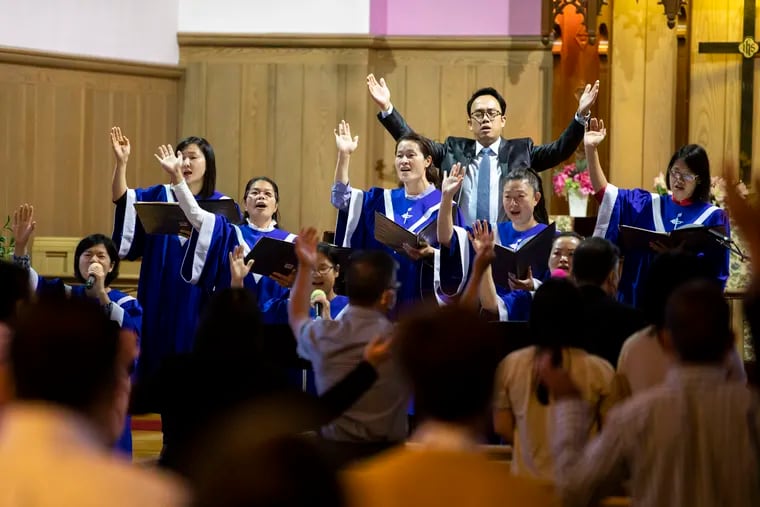 The choir sings during the 10:45 service at The Church of Grace to Fujianese in Philadelphia, Pa. on Sunday, September 27, 2020. The pastors of this church, and some congregants, use WeChat to communicate with family in China, and to host bible study sessions during the pandemic.
