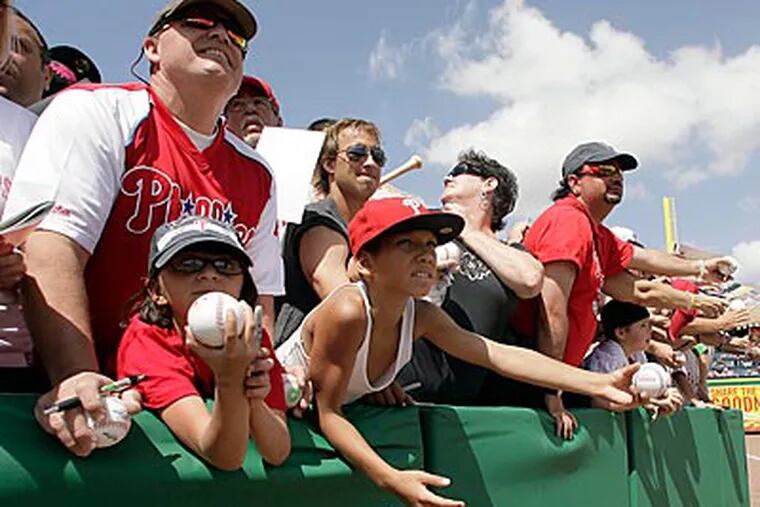 Phillies fans await autographs before a spring training game in Clearwater, Florida. (Yong Kim/Staff Photographer)