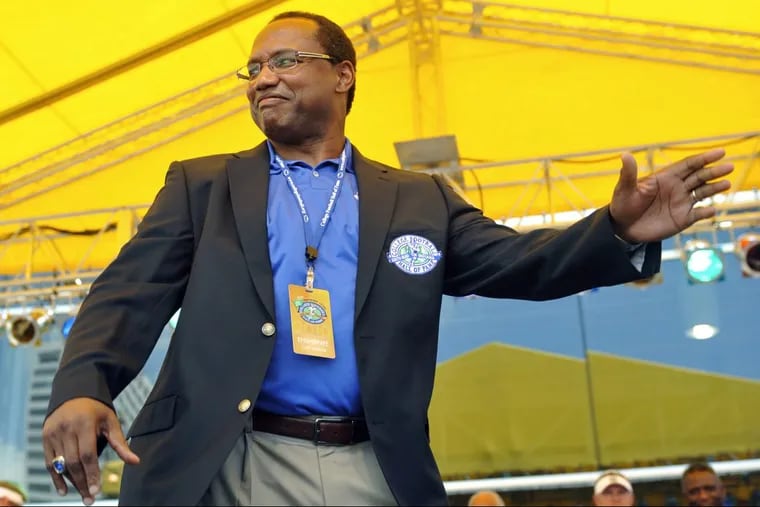 Curt Warner waves to the crowd after receiving his College Football Hall of Fame jacket during the enshrinement ceremony in July 2010 in South Bend, Ind.