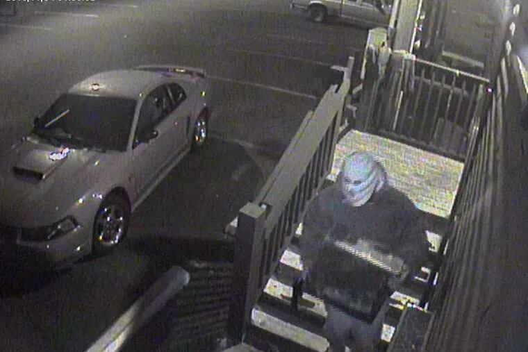 Handout photo from the Whitpain police shows a suspect with a safe after Monday's robbery at the Whitpain Tavern.
