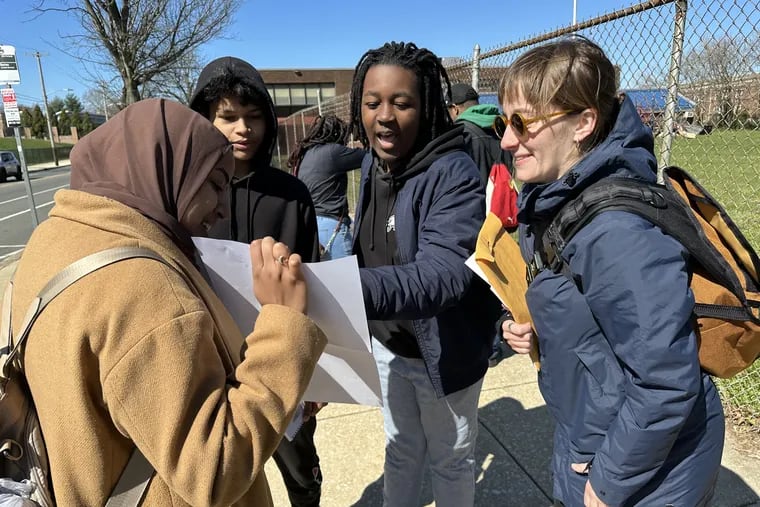 MIT graduate students Mena Mohamed (left) and Olivia Fiol (right) toured the Mill Creek neighborhood with Alain Locke School students Zarif Islam (rear left) and Zekih Presley (rear right) in March 2024. Their classes partnered to learn more about Mill Creek history and preserve the neighborhood.