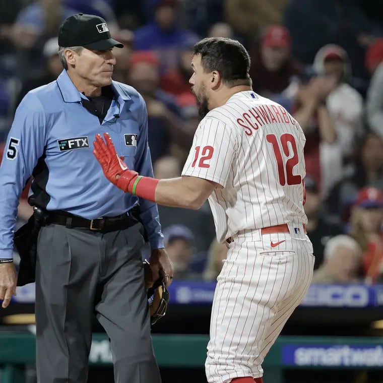 The Phillies' Kyle Schwarber argues with home plate umpire Angel Hernandez after he was called out on strikes in the ninth inning of the Milwaukee Brewers game at Citizens Bank Park in Phila., Pa. on April 24, 2022.