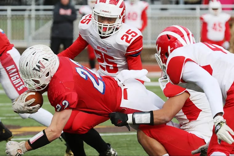 Delsea’s defense swarms around a Wall Twp. player in last year’s South Jersey Group 3 title game.