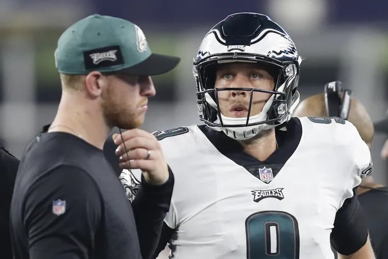Eagles quarterback Nick Foles with teammate Carson Went during a preseason game against the New England Patriots at Gillette Stadium in Foxborough, MA on Thursday, August 16, 2018.