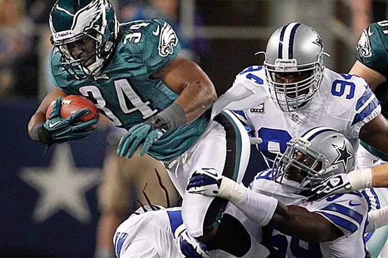 Eagles running back Bryce Brown hurdles over defenders in the loss to the Cowboys. (Ron Cortes/Staff Photographer)