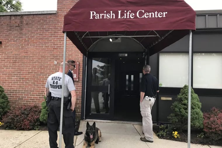 Pennsylvania State Police troopers and a search dog executed a search warrant at the parish office of St. Cornelius Catholic Church in Chadds Ford on Wednesday, May 31, 2017. Police said it was part of a criminal probe.