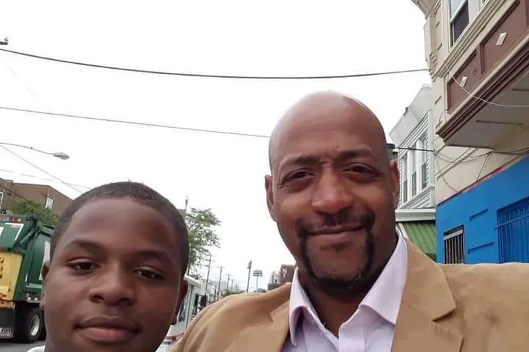 Rob Green with his son Ramone, who died on March 10 after being shot while playing basketball in West Philly in November. To protect his other three sons, Green plans to move out of the city.