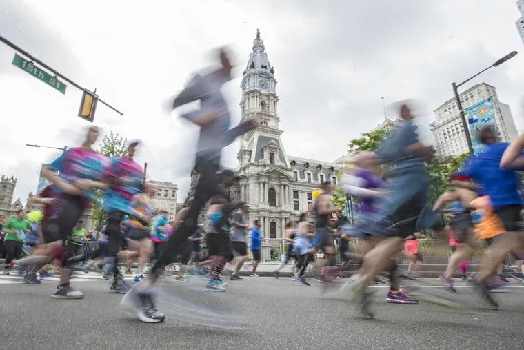 Some of the 40,000 runners in the 2017 Broad Street Run pass City Hall on their way to the finish in South Philadelphia.