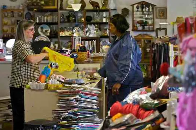 Owner Barbara DeNero assists Julie Singh at Treasure Chest Thrift, in Berlin, Camden County.