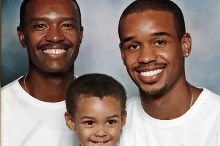 Former Temple star Lynn Greer (right) with his father, Lynn (left), and son, Lynn III. (File photo)