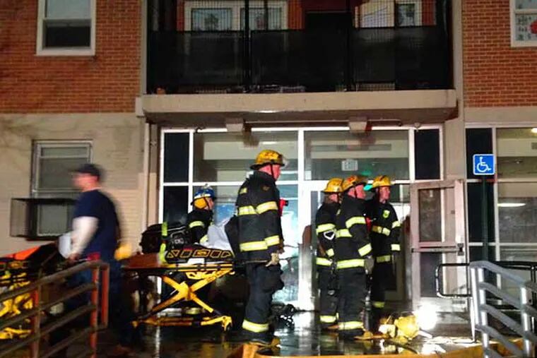 Firefighters at the scene of a high-rise fire in North Philadelphia on Dec. 6, 2013, at the 18-story Fairhill Apartments at 2443 N. 11th St. (Robert Moran / Staff)
