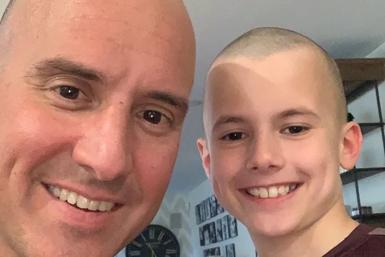 Jim Sanfilippo, who survived the coronavirus, with his son James. They cut each other's hair for charity and have now raised over $14,000 for the Food Bank of South Jersey.