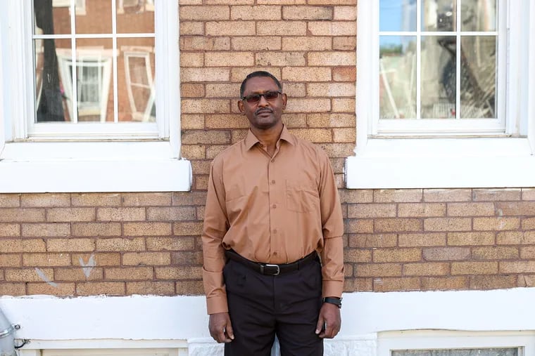 Majid Ali, 57, of Port Richmond, a behavior therapist, in front of his home. Ali is one of many people who received unemployment benefits by mistake and is now having his unemployment benefits garnished.